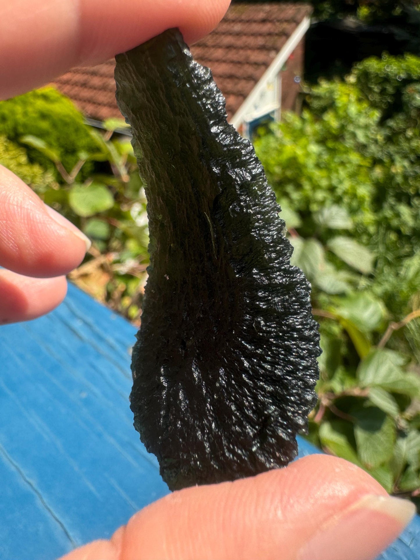 22.43g Moldavite Slavče u Trhových Svinů perfect curving drop green colour. Beautiful collector piece