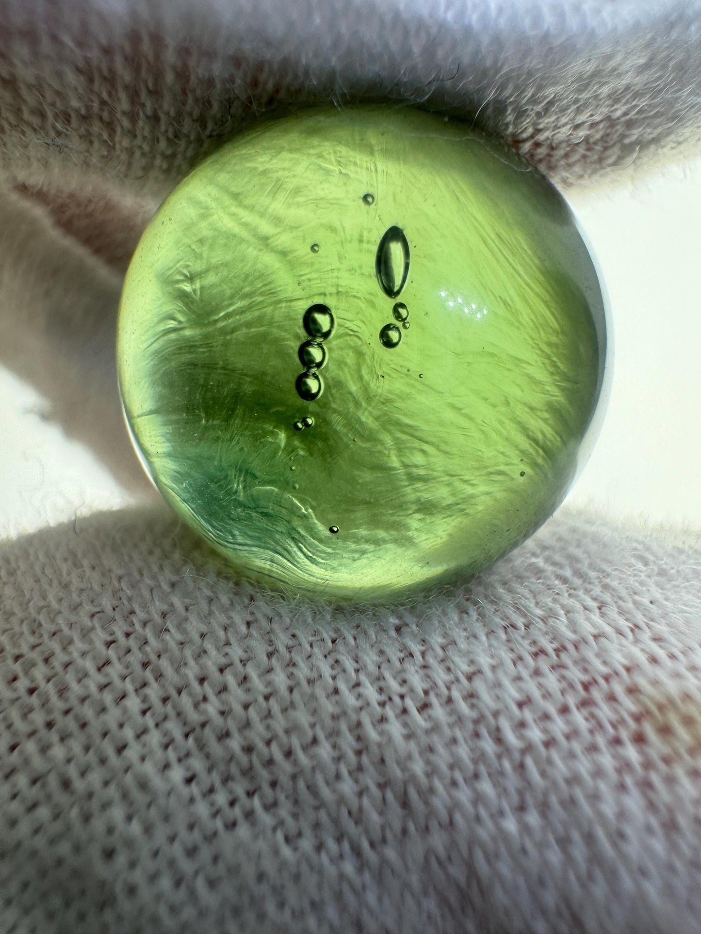 Authentic Moldavite sphere lovely light green color,  15.7mm for collection. 4.7grams or 23.5 carats inner gas bubbles