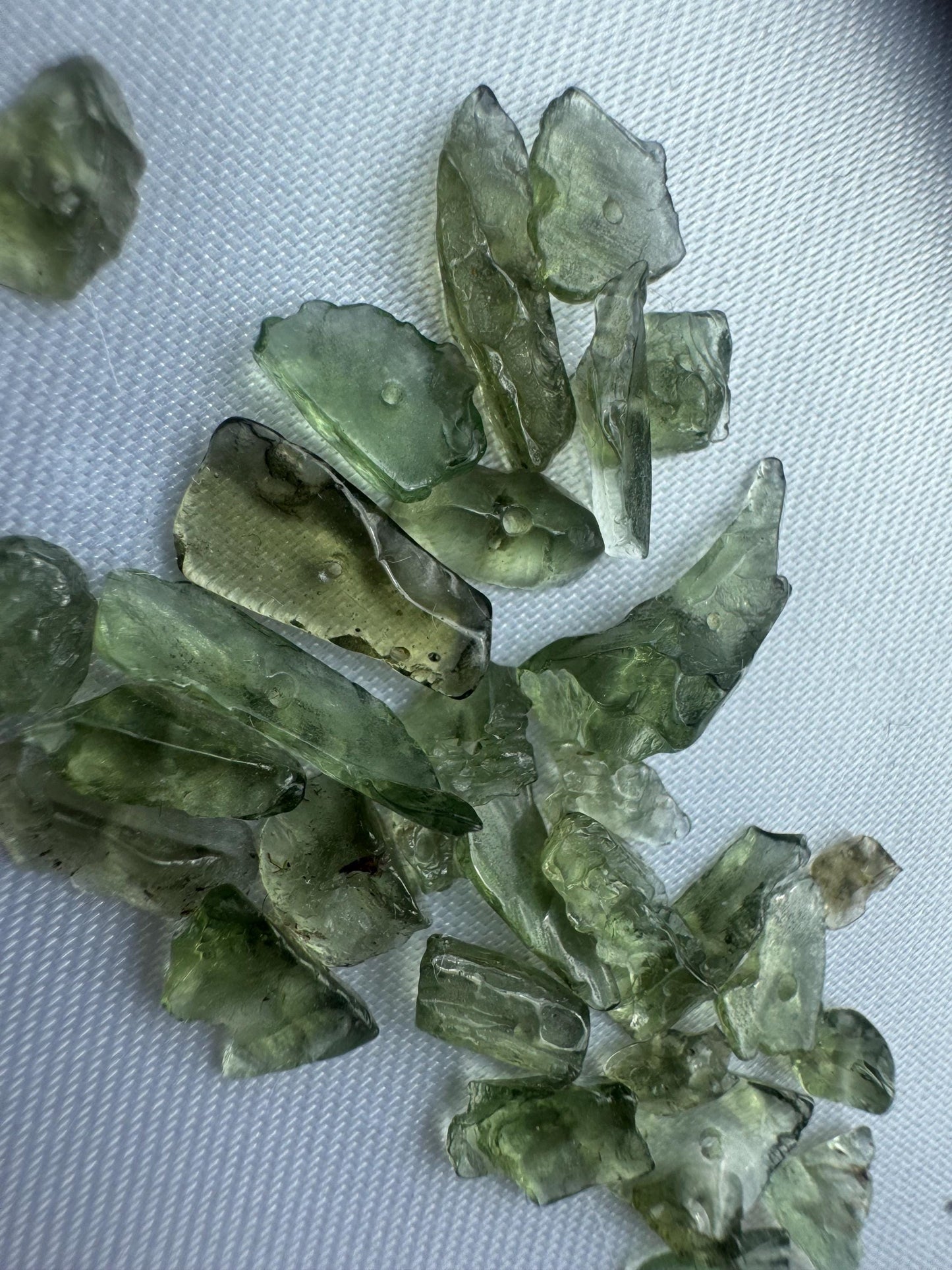 Authentic Moldavite semi polished with hole price base 1g included multiple pieces