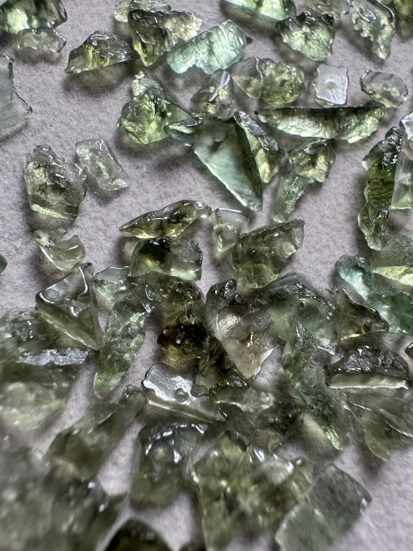 Authentic Moldavite semi polished with hole price base 1g included multiple pieces