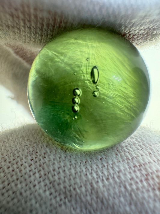 Authentic Moldavite sphere lovely light green color,  15.7mm for collection. 4.7grams or 23.5 carats inner gas bubbles