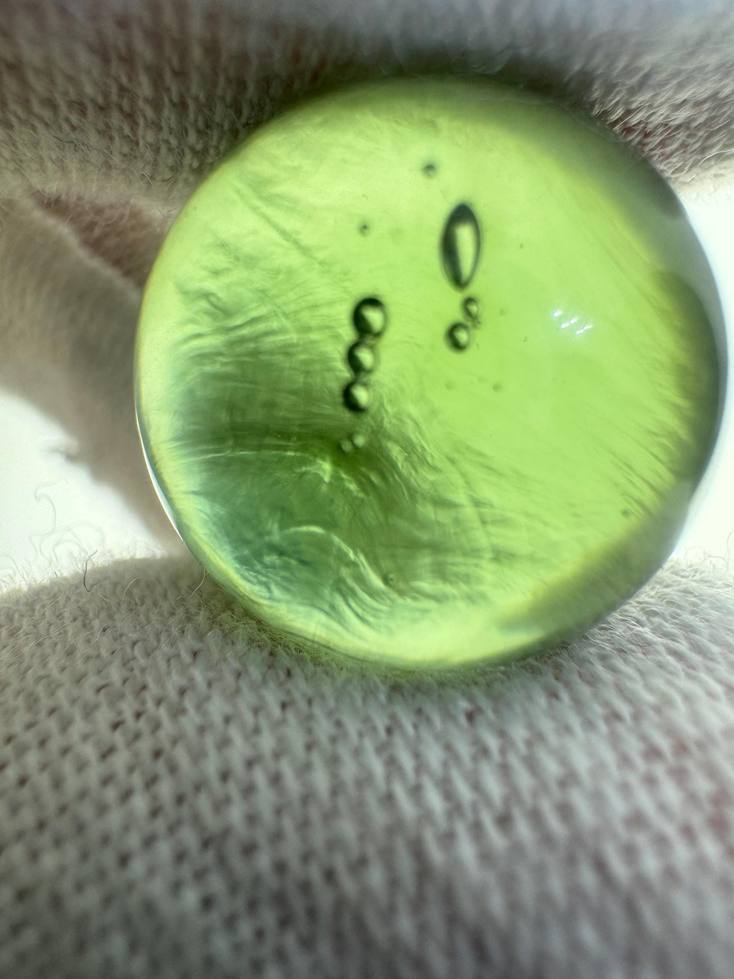 Authentic Moldavite sphere lovely light green color,  15.7mm for collection. 4.7grams or 23.5 carats inner gas bubbles